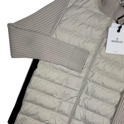 Moncler beige full zip jacket with logo detail and nylon/wool blend material.