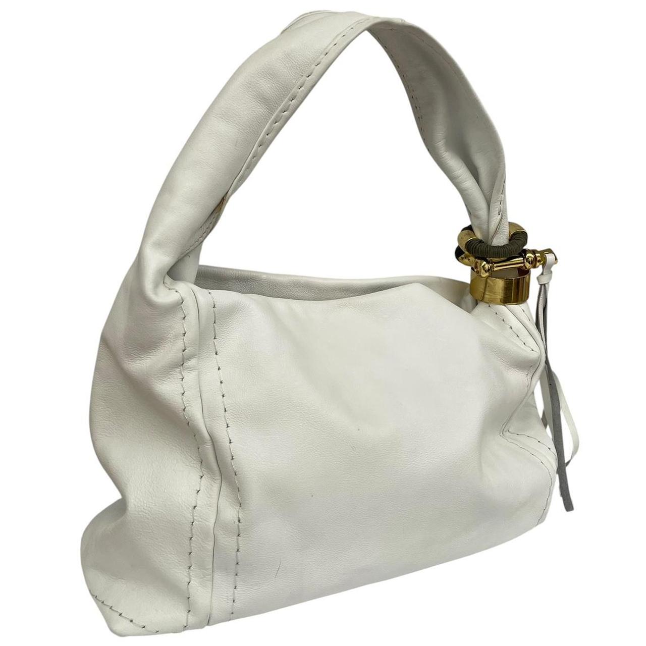 Jimmy Choo white leather hobo bag with subtle marks and logo detail.