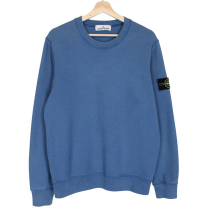 Stone Island blue cotton sweatshirt with iconic compass logo and ribbed cuffs.