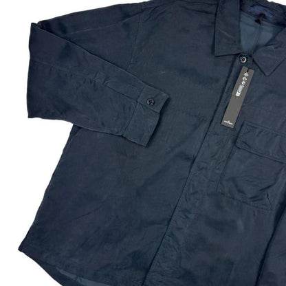 Stone Island navy blue overshirt jacket with flap pocket and monochrome logo patch.
