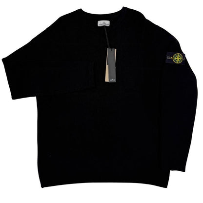 Stone Island black ribbed knit jumper with logo badge and organic cotton material.