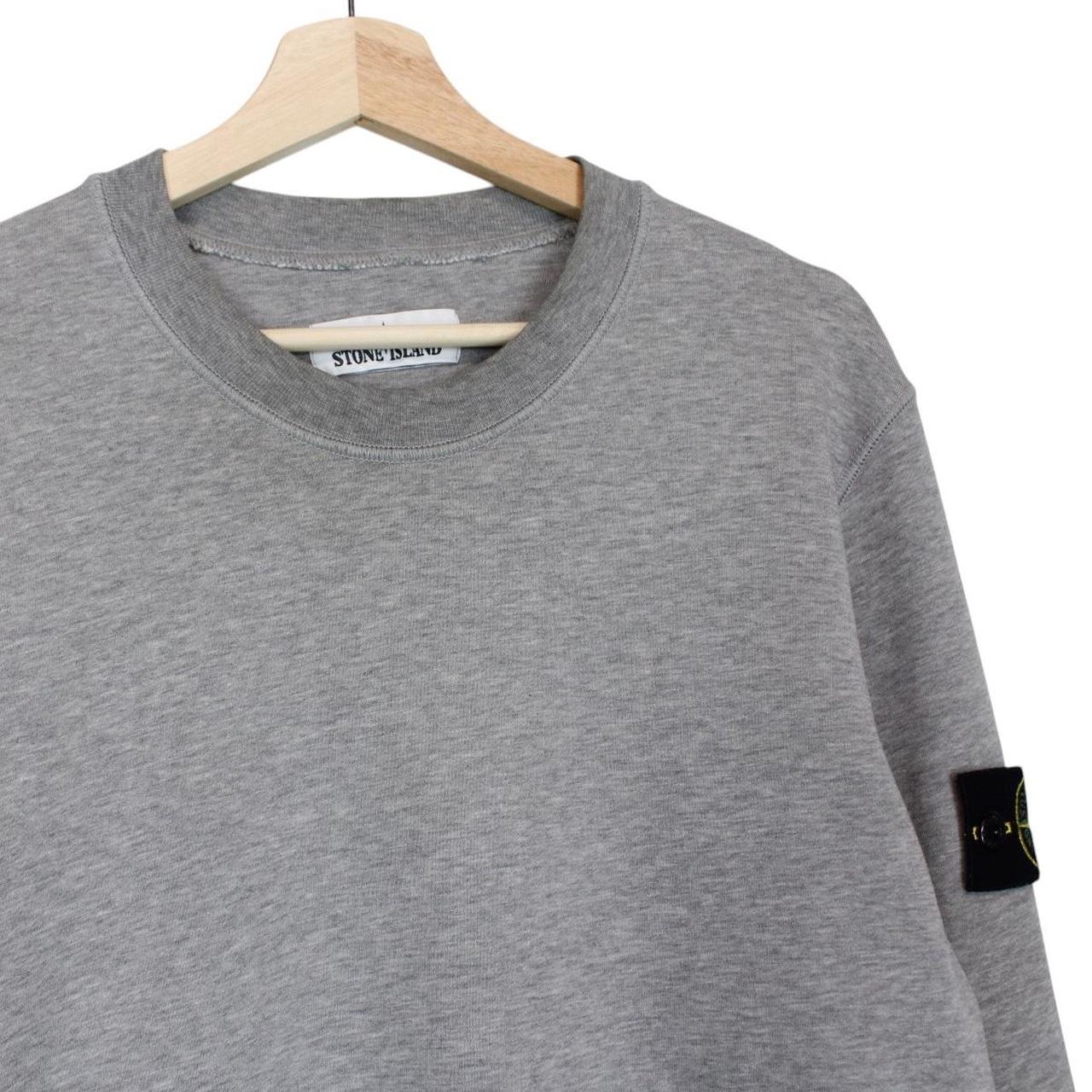 Stone Island grey cotton sweatshirt with logo patch and soft texture.