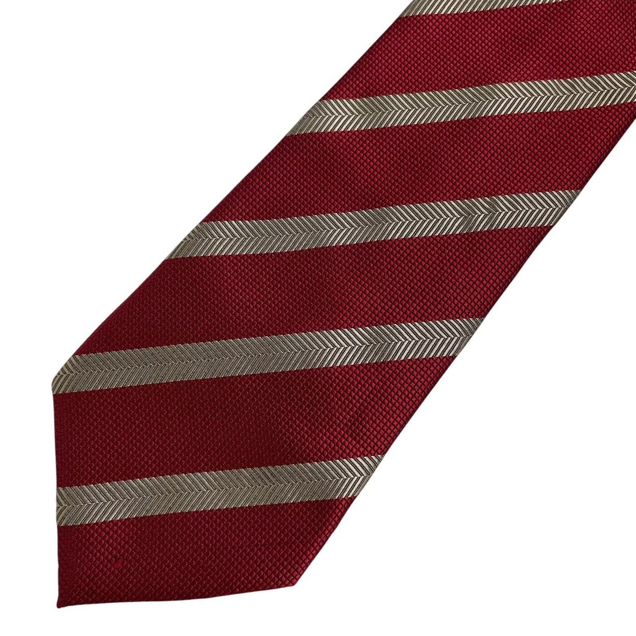 Hugo Boss red striped silk tie with subtle sheen and classic design.