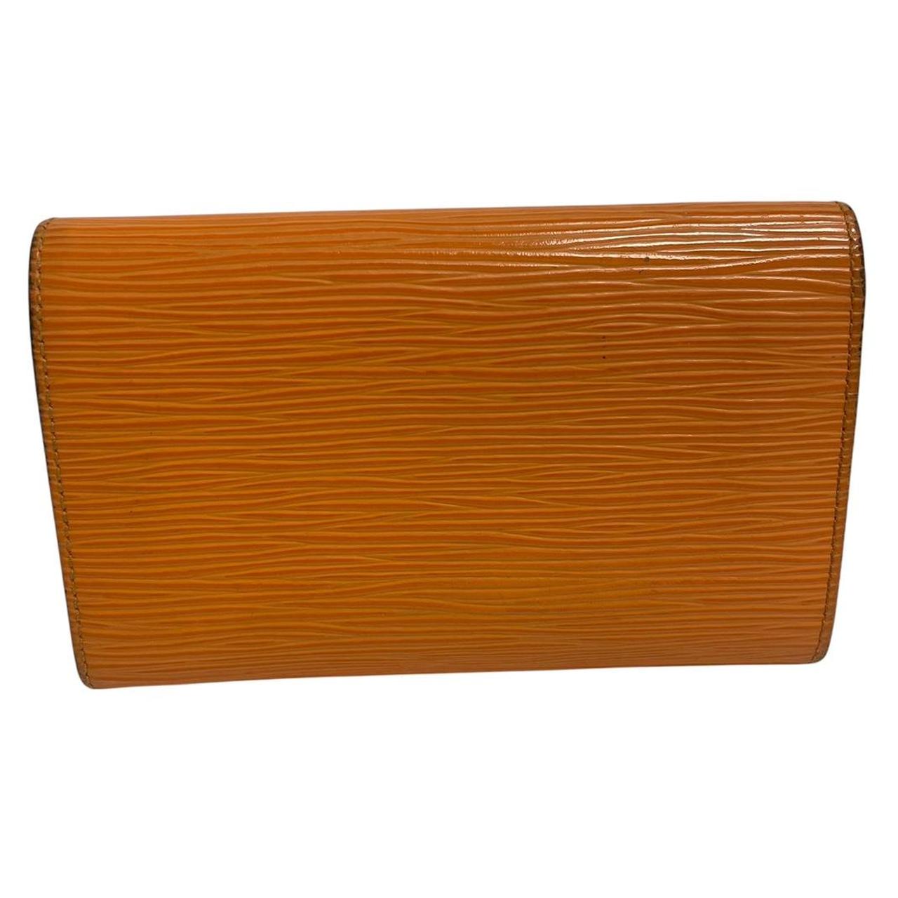 Louis Vuitton orange leather wallet with Epi texture and embossed logo detail.