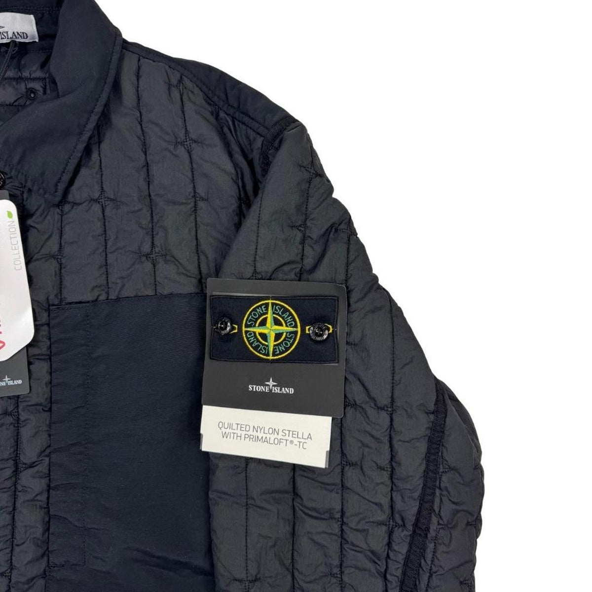 Stone Island black quilted nylon jacket with logo badge and Primaloft-TC material.