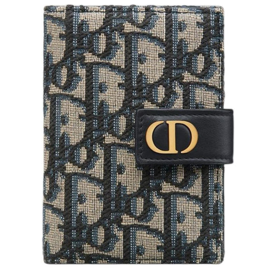 Dior blue card holder featuring Oblique jacquard pattern and dandelion design.