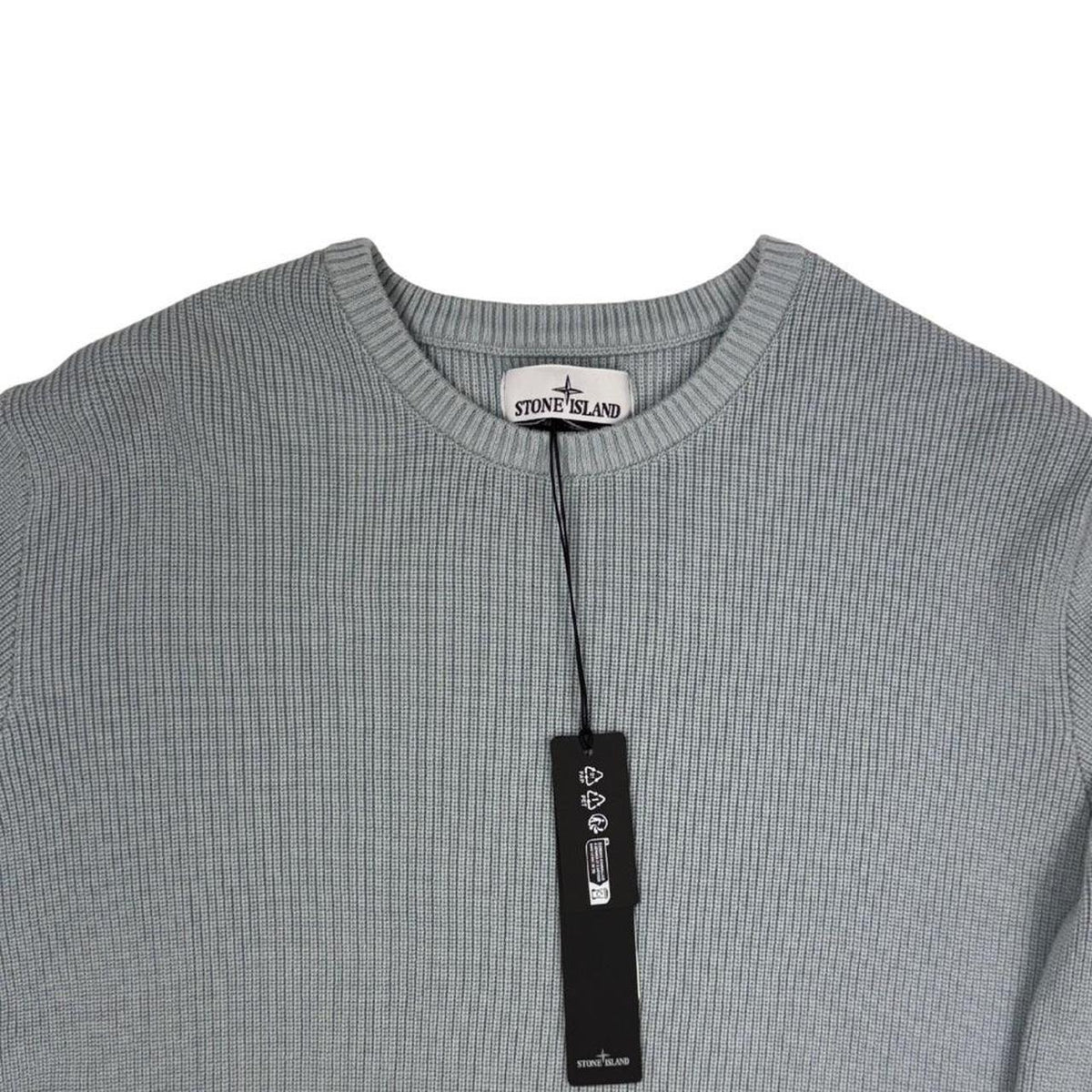 Stone Island grey waffle knit jumper with logo patch and organic cotton material.