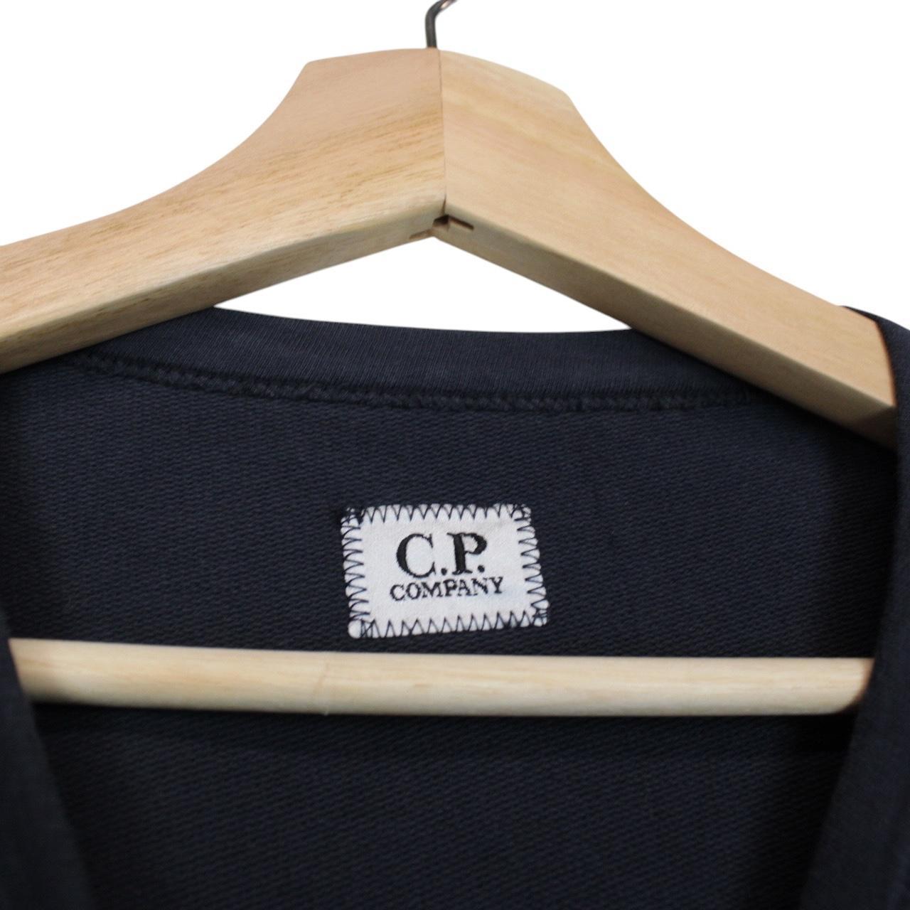 CP Company navy blue cotton sweatshirt with goggle lens detail and logo.