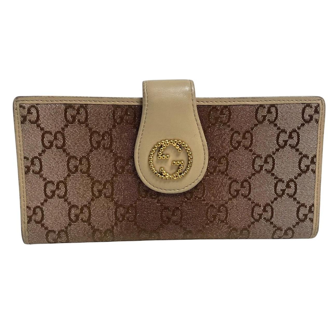 Gucci beige and pink GG monogram continental wallet with logo and wear details.