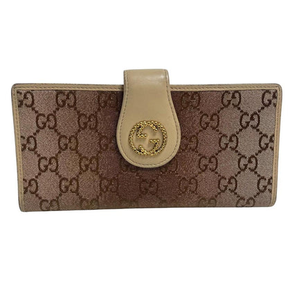 Gucci beige and pink GG monogram continental wallet with logo and wear details.