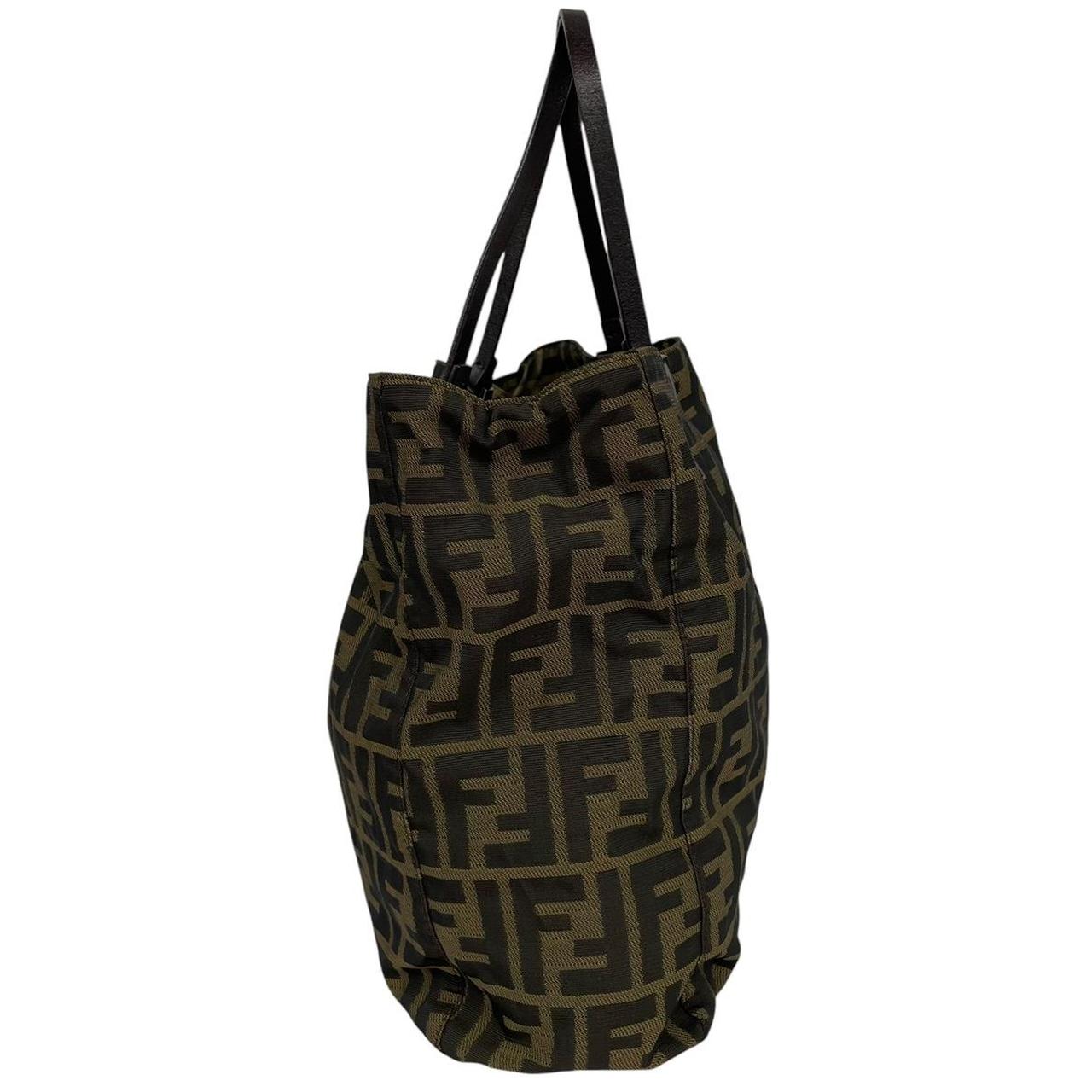 Fendi brown duffel bag featuring iconic Zucca monogram canvas and leather handles.