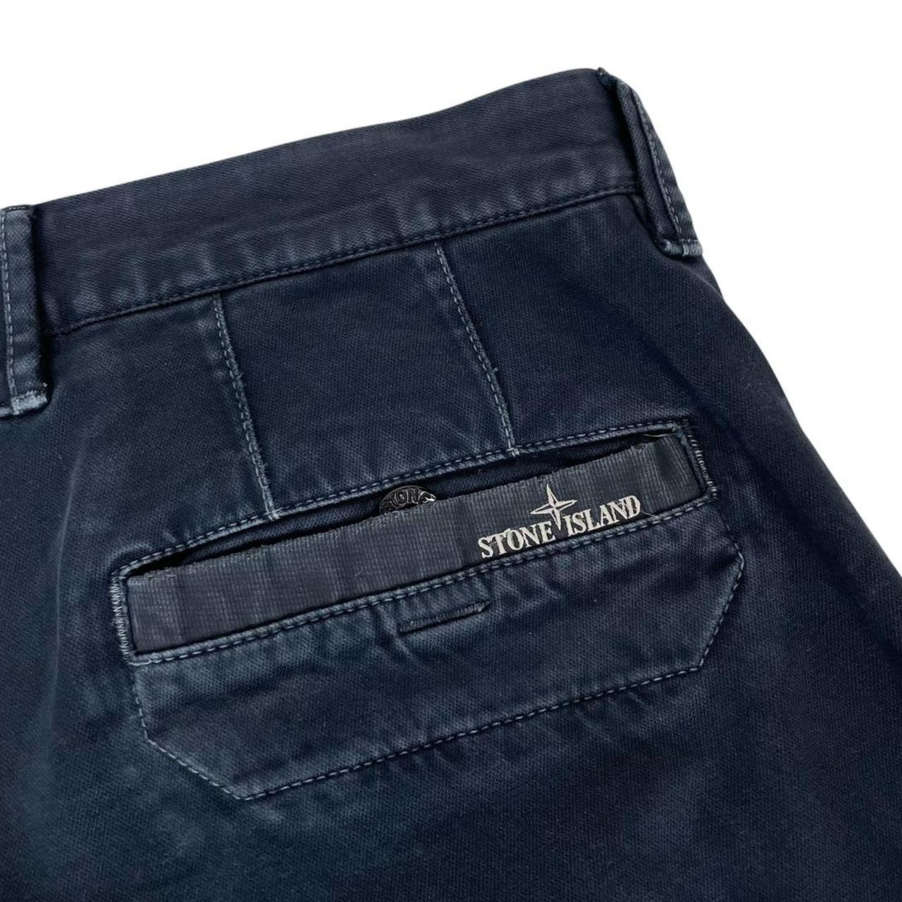 Stone Island navy blue slim fit cotton trousers with logo patch and clean design.