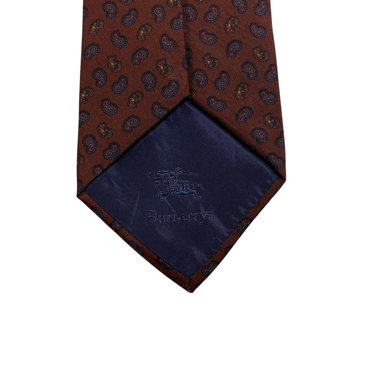 Burberry brown silk tie with vintage paisley print design and logo detail.