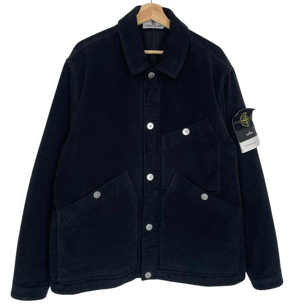 Stone Island navy blue work jacket with detachable compass badge and button-down closure.