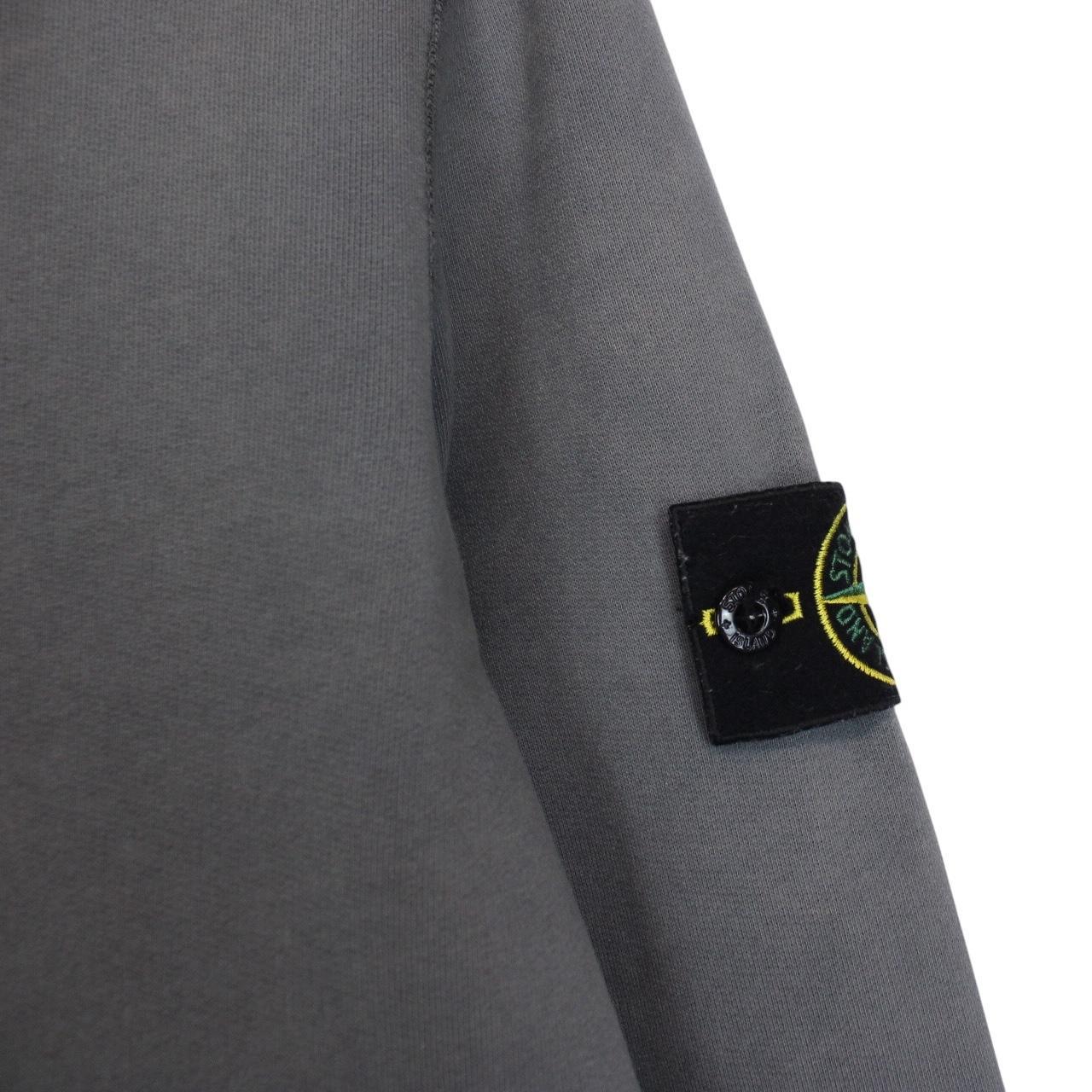 Stone Island grey cotton sweatshirt with embroidered compass logo and slight discolouration.