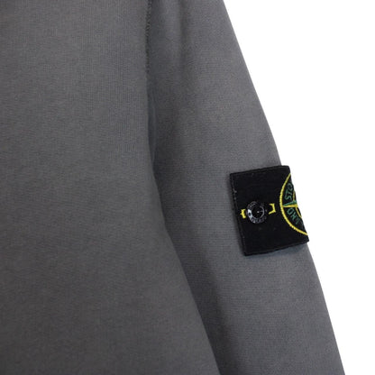 Stone Island grey cotton sweatshirt with embroidered compass logo and slight discolouration.