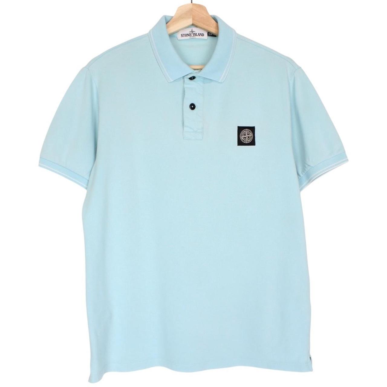 Stone Island blue polo shirt with embroidered compass logo and slim fit cotton material.