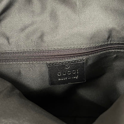 Gucci black hobo shoulder bag with monogram canvas and leather detailing.