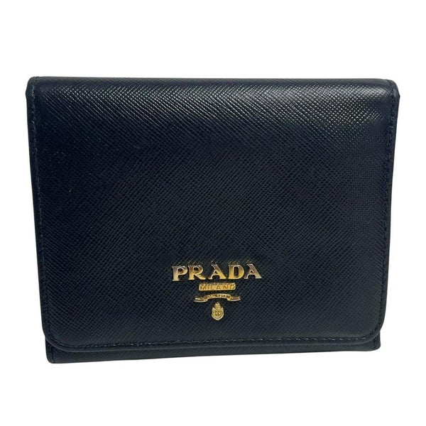 Prada black bifold wallet Saffiano leather with logo embossed detail.