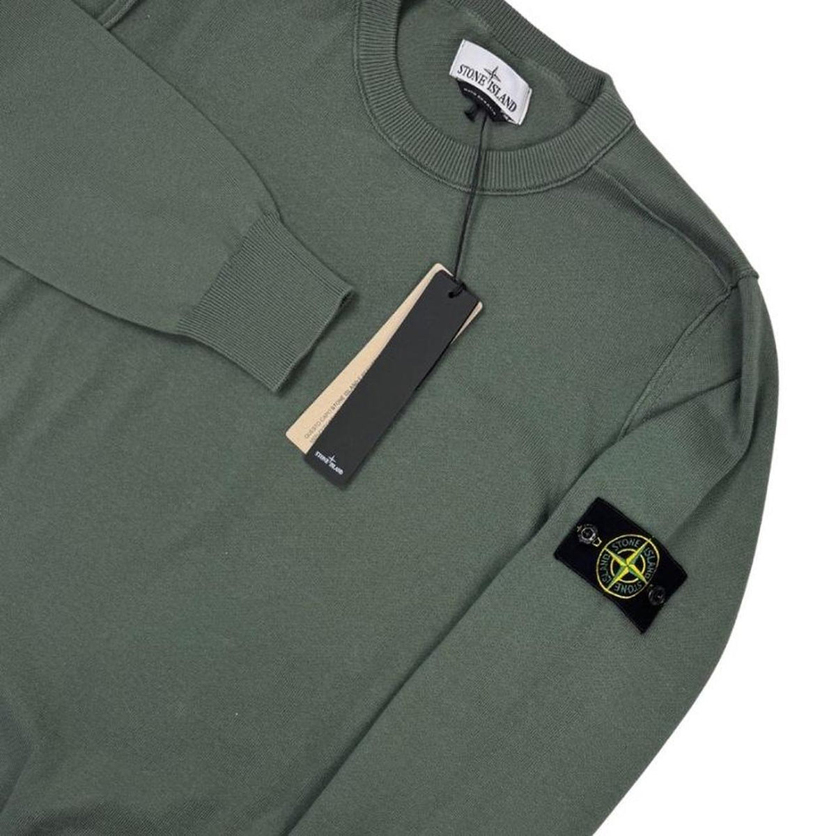 Stone Island green knit jumper made from organic cotton with logo patch detail.