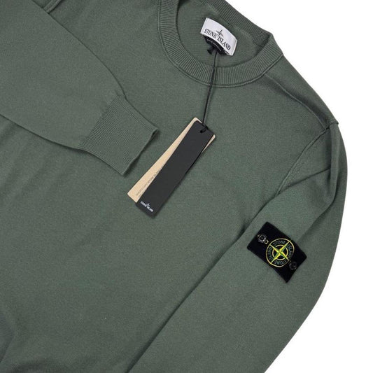 Stone Island green knit jumper made from organic cotton with logo patch detail.