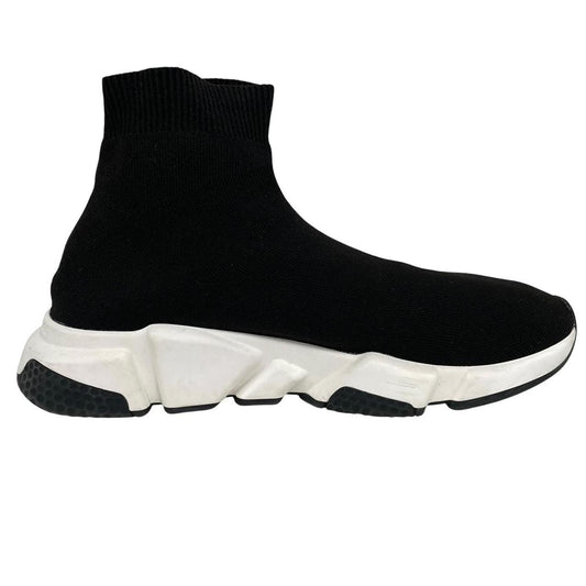 Balenciaga Speed 2 black and white trainers with logo detailing and cotton material.