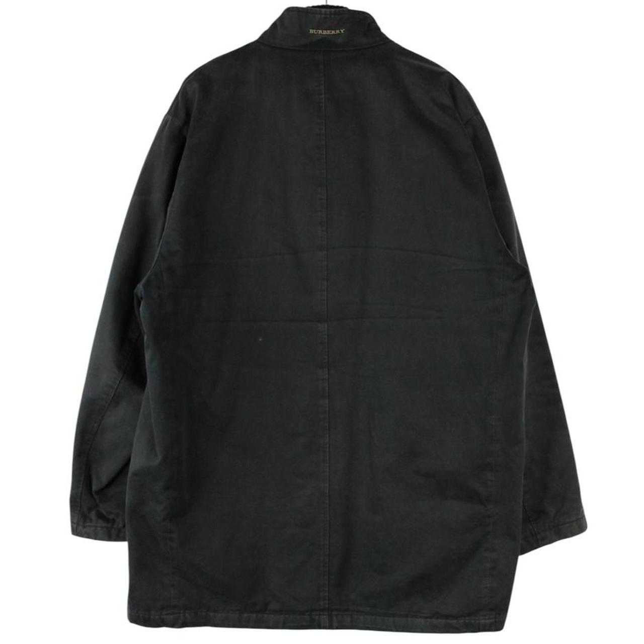 Burberry black coat with Nova Check lining and full zip closure, vintage style.