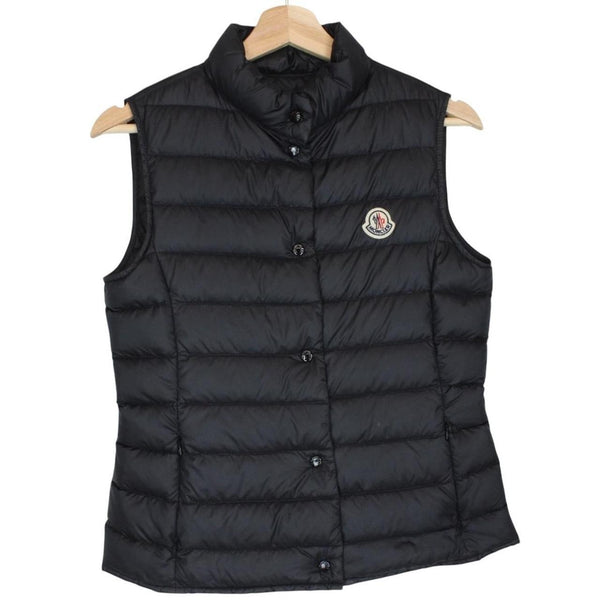 Moncler black quilted shell down gilet with logo patch and zip pockets.