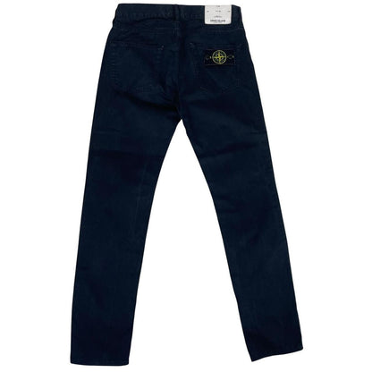 Stone Island black slim fit cotton trousers with iconic compass logo patch.
