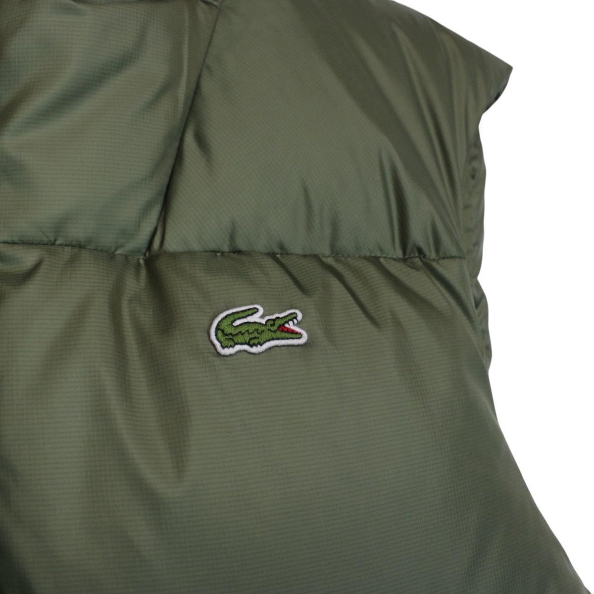 Lacoste khaki green bodywarmer full zip with signature crocodile logo and water-repellent material.