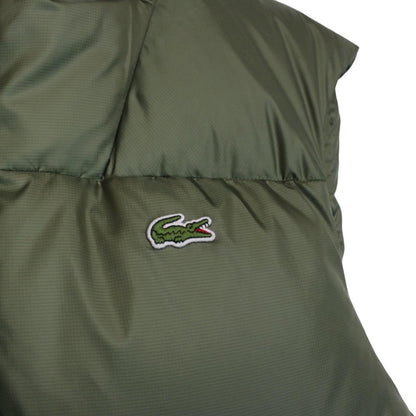 Lacoste khaki green bodywarmer full zip with signature crocodile logo and water-repellent material.