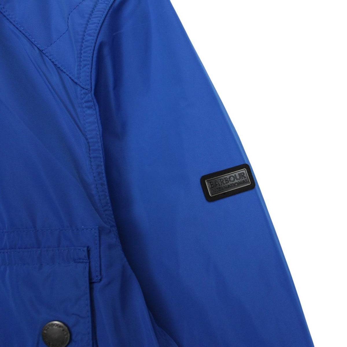 Barbour blue nylon multi-pocket jacket with logo detailing and scuff on bottom right pocket.