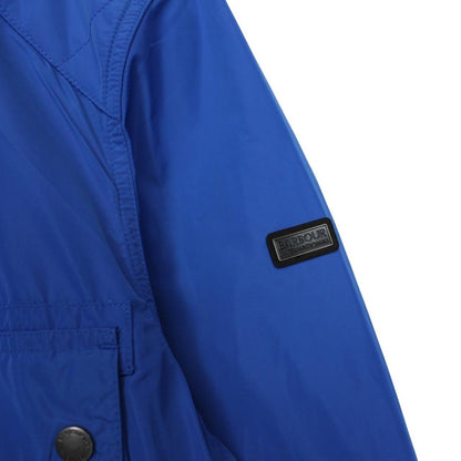 Barbour blue nylon multi-pocket jacket with logo detailing and scuff on bottom right pocket.