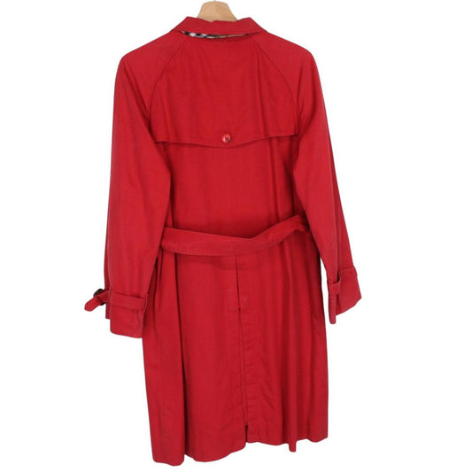 Burberry red trench coat with Nova Check pattern and belted waist detail.