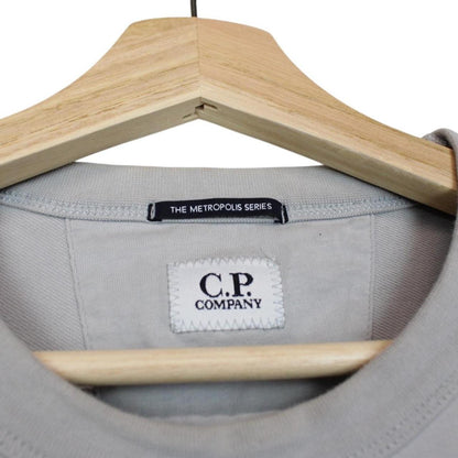 CP Company grey cotton sweatshirt with logo patch and ribbed cuffs.