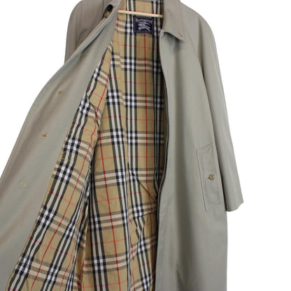Burberry khaki green trench coat featuring Nova Check pattern and single breasted design.