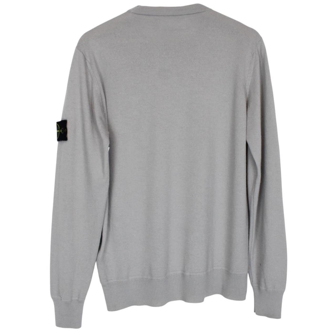 Stone Island grey wool knit jumper with logo patch and subtle wear marks.