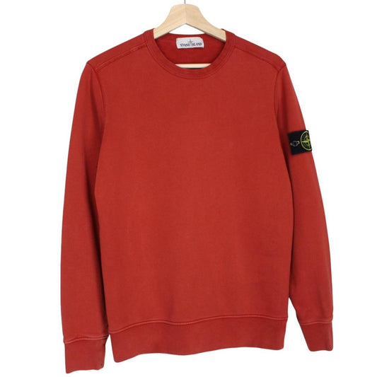 Stone Island red cotton sweatshirt with logo badge and ribbed cuffs.