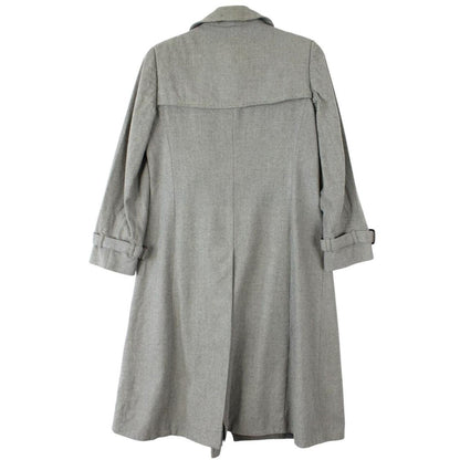 Burberry grey double breasted wool trench coat with classic check lining and logo buttons.