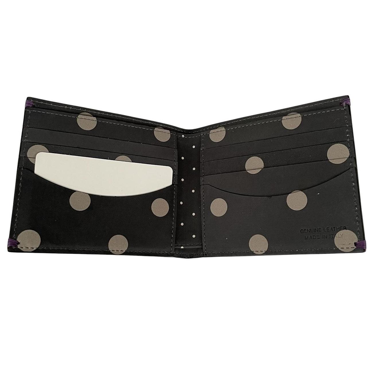 Paul Smith grey leather bifold wallet with polka dot pattern and embossed logo.