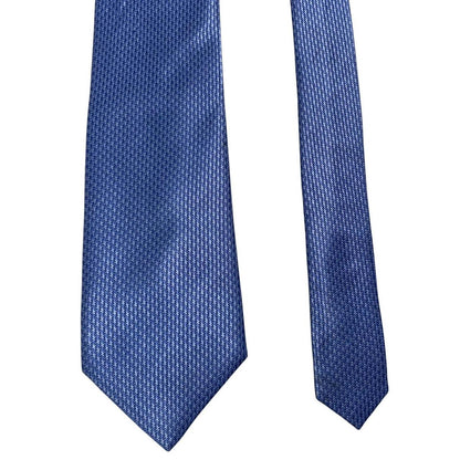 DKNY blue silk tie with subtle sheen and classic design.