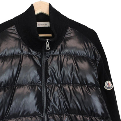 Moncler black cardigan jacket with full zip, wool/nylon blend, and logo detail.