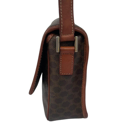 CELINE brown duffel bag with Macadam canvas pattern and logo detail.
