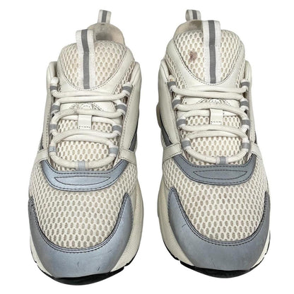 Dior grey and white trainers with logo detailing and worn soles.