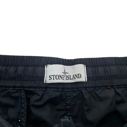 Stone Island navy blue cargo trousers with logo patch and RE-T fit design.