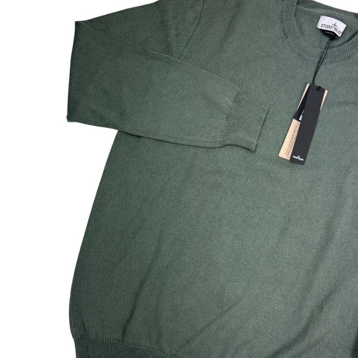 Stone Island green knit jumper made from organic cotton with logo patch detail.