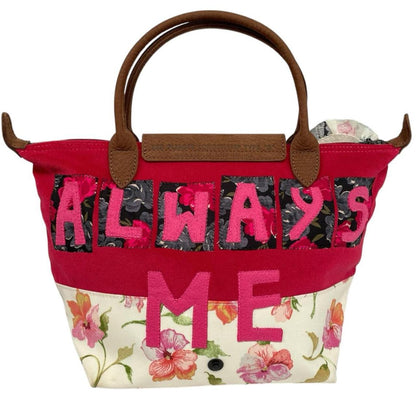 Longchamp multi tote bag featuring Tracey Emin artwork and iconic foldable design.