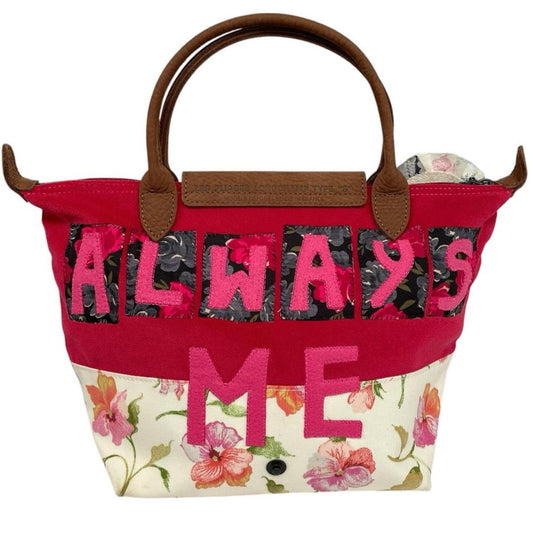 Longchamp multi tote bag featuring Tracey Emin artwork and iconic foldable design.