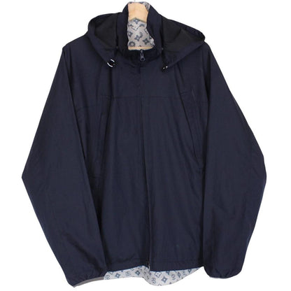 Stüssy reversible nylon jacket in grey and navy blue with logo detailing.