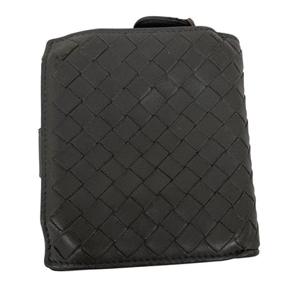 Bottega Veneta grey bifold wallet with Intrecciato woven leather pattern and popper closure.